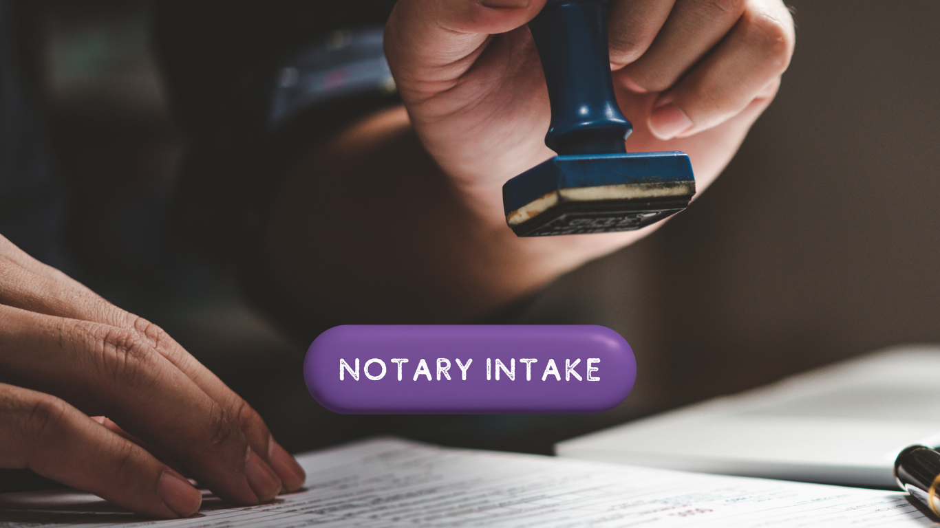Someone holding a notary stamp above a document and intake button